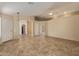 Bright living room boasting tile floors, arched doorways, and a neutral color scheme at 5336 W Campo Bello Dr, Glendale, AZ 85308