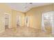 Large, bright main bedroom with vaulted ceilings, ceiling fan, tile floors, and plenty of natural light at 5336 W Campo Bello Dr, Glendale, AZ 85308