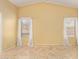 Bright main bedroom with vaulted ceilings, tile floors, and two windows with curtains for privacy at 5336 W Campo Bello Dr, Glendale, AZ 85308