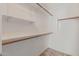 Functional walk-in closet with shelving and hanging rods for optimal storage at 5336 W Campo Bello Dr, Glendale, AZ 85308