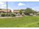 A spacious backyard offers a grassy lawn and mature landscaping at 5415 E Mckellips Rd # 100, Mesa, AZ 85215