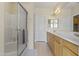 Clean bathroom featuring a glass-enclosed shower and a long vanity at 5415 E Mckellips Rd # 100, Mesa, AZ 85215
