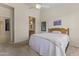 Comfortable bedroom with neutral tones and access to the bathroom at 5415 E Mckellips Rd # 100, Mesa, AZ 85215