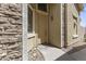 Inviting front entryway with stone accents, a welcome mat, and a charming light fixture at 5415 E Mckellips Rd # 100, Mesa, AZ 85215