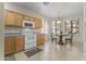 Eat-in kitchen featuring modern appliances, tile flooring, and a breakfast nook at 5415 E Mckellips Rd # 100, Mesa, AZ 85215