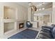 Spacious living room featuring a fireplace, tile flooring, and a view of the second story at 5415 E Mckellips Rd # 100, Mesa, AZ 85215