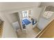 A view from the loft shows a bright living room with fireplace and blue accents at 5415 E Mckellips Rd # 100, Mesa, AZ 85215
