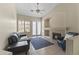 Cozy living room with a fireplace, comfortable seating, tile floors, and access to the outdoors at 5415 E Mckellips Rd # 100, Mesa, AZ 85215