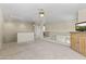 This loft features neutral walls and carpeting, ceiling fans, and decorative railing overlooking the floor below at 5415 E Mckellips Rd # 100, Mesa, AZ 85215