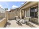 A covered patio with lounge chairs and table offers relaxation at 5415 E Mckellips Rd # 100, Mesa, AZ 85215