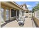 A covered patio features chairs and overlooks a low-maintenance yard at 5415 E Mckellips Rd # 100, Mesa, AZ 85215
