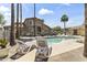 Enjoy poolside lounging with several chairs available around the refreshing community pool and lush landscaping at 5415 E Mckellips Rd # 100, Mesa, AZ 85215