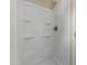 A full shower stall features an adjustable shower head and built-in shelving at 5415 E Mckellips Rd # 100, Mesa, AZ 85215