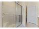 Enclosed tiled shower with glass doors and a built-in seat at 5415 E Mckellips Rd # 100, Mesa, AZ 85215
