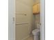 Practical half bathroom featuring a toilet and a small cabinet at 5415 E Mckellips Rd # 100, Mesa, AZ 85215