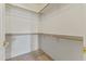 Walk-in closet featuring neutral carpet and multiple shelves at 5415 E Mckellips Rd # 100, Mesa, AZ 85215