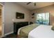 Well-lit bedroom with a large window providing natural light and balcony access at 5450 E Deer Valley Dr # 1176, Phoenix, AZ 85054
