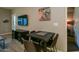 Cozy dining area with a black table and four chairs adjacent to the kitchen at 5450 E Deer Valley Dr # 1176, Phoenix, AZ 85054