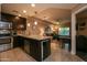 Stylish kitchen with stainless steel appliances, island with seating, and an open layout to the living area at 5450 E Deer Valley Dr # 1176, Phoenix, AZ 85054