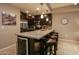Stylish kitchen island with stainless steel appliances, seating, and a wine cooler at 5450 E Deer Valley Dr # 1176, Phoenix, AZ 85054