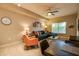 Open concept living room featuring a sectional sofa, accent chair, and view of dining area at 5450 E Deer Valley Dr # 1176, Phoenix, AZ 85054