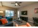 Comfortable living room with a sectional sofa, TV, and window to the outside at 5450 E Deer Valley Dr # 1176, Phoenix, AZ 85054