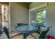 Charming patio features a glass-topped table with four chairs offering a relaxing outdoor experience at 5450 E Deer Valley Dr # 1176, Phoenix, AZ 85054