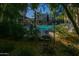 Resort-style pool area framed by lush greenery, offering a tranquil escape at 5450 E Deer Valley Dr # 1176, Phoenix, AZ 85054