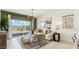 Cozy living room with neutral tones, stylish furniture, and a sliding glass door leading to the backyard at 5530 E Mearn Rd, San Tan Valley, AZ 85140