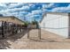 The backyard is enclosed by a chain-link fence, offering security and privacy at 6701 W Monterey Way, Phoenix, AZ 85033