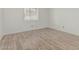 Neutral bedroom featuring tile floors and a window with blinds at 6701 W Monterey Way, Phoenix, AZ 85033