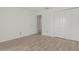 Neutral bedroom features tile floors and ample closet space at 6701 W Monterey Way, Phoenix, AZ 85033
