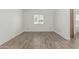 Bedroom featuring wood-look tile floor and neutral paint at 6701 W Monterey Way, Phoenix, AZ 85033