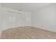 Neutral bedroom with tiled floors and ample closet space at 6701 W Monterey Way, Phoenix, AZ 85033