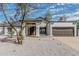 Charming single story home featuring a two-car garage and a well kept xeriscape front yard at 6701 W Monterey Way, Phoenix, AZ 85033