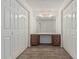 Hallway features built-in vanity and dual closets at 6701 W Monterey Way, Phoenix, AZ 85033