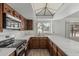 Spacious kitchen featuring marble countertops, stainless steel appliances, and abundant cabinet space at 6701 W Monterey Way, Phoenix, AZ 85033