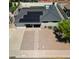 Aerial view of home with desert landscaping, mature trees, solar panels, and a front porch at 7320 E Pierce St, Scottsdale, AZ 85257