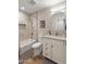 Bright bathroom featuring a tub/shower, modern vanity with granite counters, and neutral tile work at 7320 E Pierce St, Scottsdale, AZ 85257
