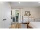 Bedroom with a patio slider, dresser, and light-filled space with neutral colors at 7320 E Pierce St, Scottsdale, AZ 85257