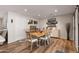 Elegant dining area with a rustic wooden table, modern lighting, and stylish decor at 7320 E Pierce St, Scottsdale, AZ 85257
