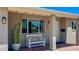 Inviting front porch with decorative bench, desert landscaping, and a modern exterior at 7320 E Pierce St, Scottsdale, AZ 85257
