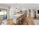 Sunlit kitchen with island, white cabinets, and stainless steel appliances at 7320 E Pierce St, Scottsdale, AZ 85257