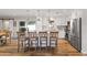 Well-lit kitchen with a center island, stainless steel appliances, and a seamless transition to the dining area at 7320 E Pierce St, Scottsdale, AZ 85257