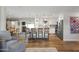 Open living space with hardwood floors, white kitchen, and dining area at 7320 E Pierce St, Scottsdale, AZ 85257