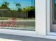 Image of a window with reflection of the outdoors, bringing natural light inside at 7320 E Pierce St, Scottsdale, AZ 85257
