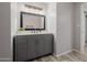 Well-lit bathroom vanity with a gray cabinet and modern fixtures at 7615 E Tucson Rd, Scottsdale, AZ 85258