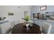 Charming dining area with a round table and stylish seating near the modern kitchen at 7615 E Tucson Rd, Scottsdale, AZ 85258