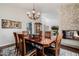 Charming dining room with wood table and fireplace, perfect for gatherings and entertaining at 7615 E Tucson Rd, Scottsdale, AZ 85258