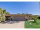 Charming single-story home featuring desert landscaping with mature cacti and a well maintained front yard at 7615 E Tucson Rd, Scottsdale, AZ 85258